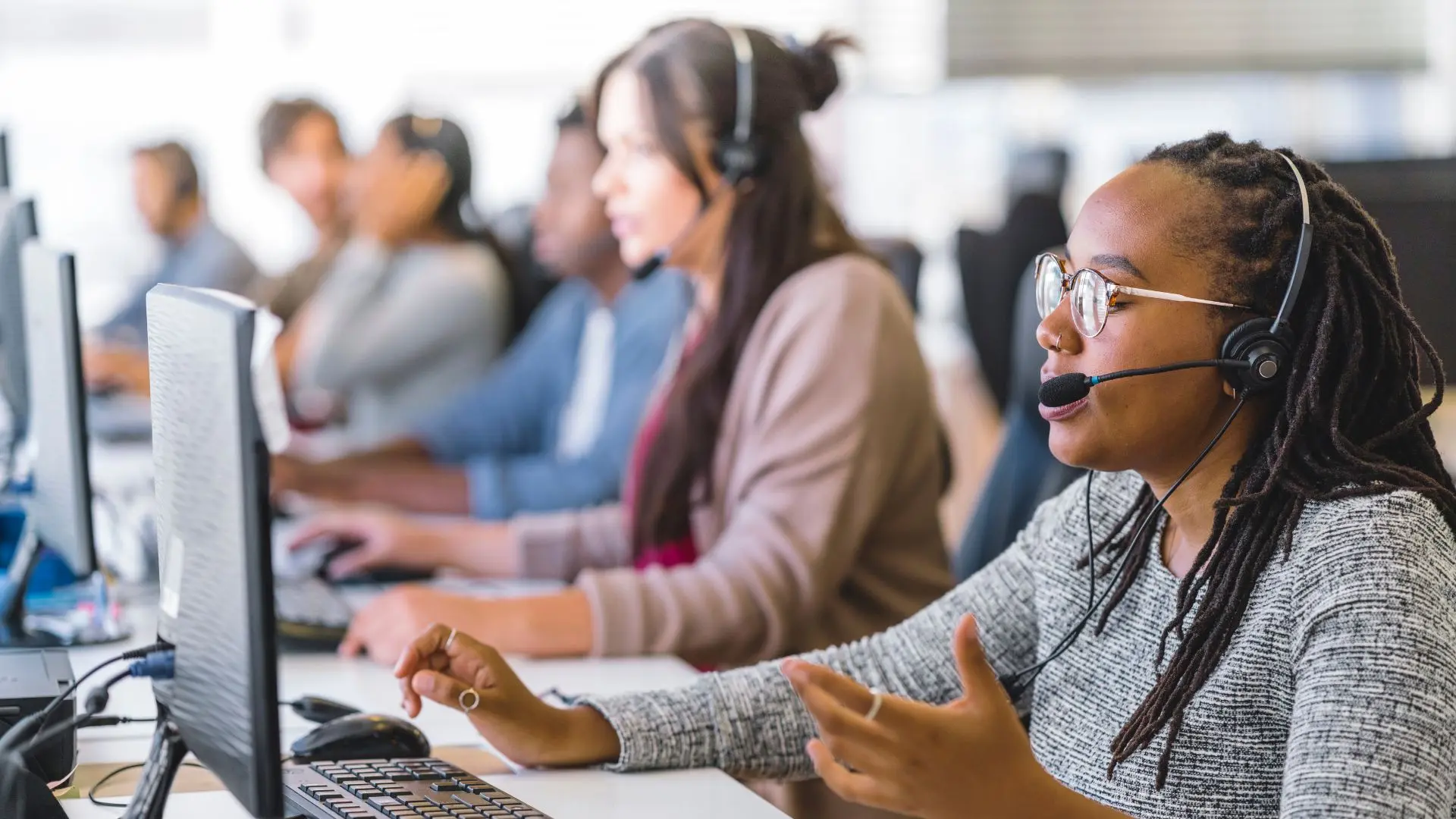 POS system customer support center agents assisting customers.